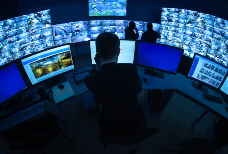 A person Monitoring CCTV Cameras