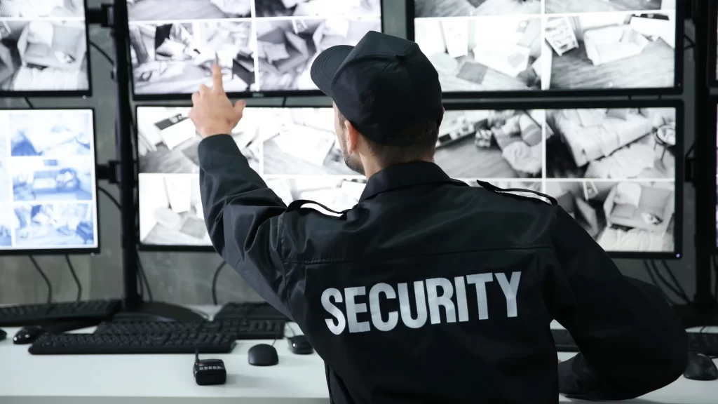 Security guard monitoring CCTV